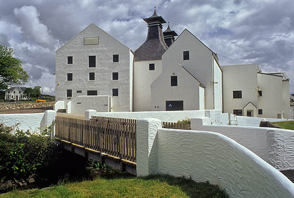 SCO: Strathclyde Region, Argyll & Bute, Inner Hebrides, Islay, Port Ellen, Lagavulin, General view of distillery entrance, showing foot bridge over old mill stream. [Ask for #246.376.]