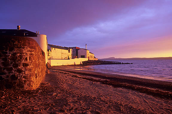 SCO: Strathclyde Region, Argyll & Bute, Inner Hebrides, Islay, Bowmore, Sunset view from harbor towards the Bowmore Distillery [Ask for #246.507.]