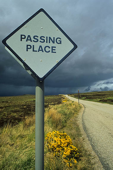SCO: Highland Region, Sutherland District, Central Moors, Altnaharra, Passing place on the single-lane A836, the main highway crossing the central moorlands of Sutherland; storm in bkgd [Ask for #246.886.]