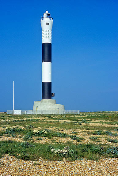 ENG: South East Region, Kent, Romney Marsh, The South Marsh, Dungeness, The New Lighthouse at Dungeness, showing its remote location on the shingle. [Ask for #256.487.]
