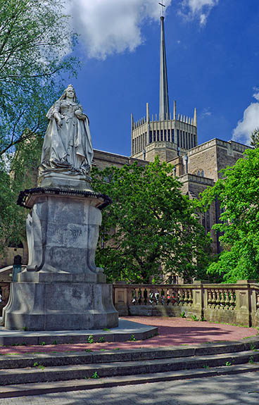ENG: The Northwest Region, Lancashire, The Pennines, Blackburn-with-Darwen, Blackburn Cathedral, Statue of Queen Victoria outside the cathedral, showing the Lantern Tower, 1999. [Ask for #270.374.]