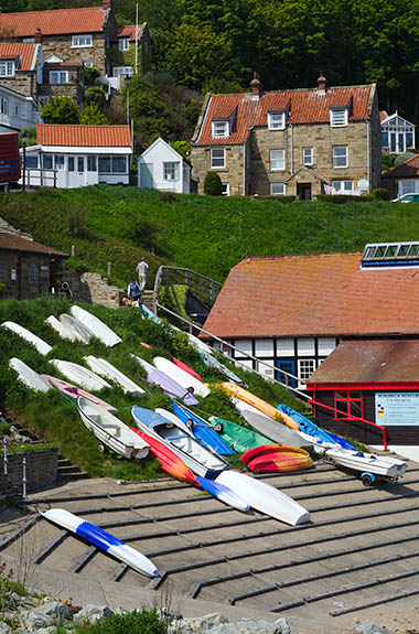 ENG: Yorkshire & Humberside Region, North Yorkshire, North Yorkshire Coast, Sea Cliffs, Runswick Bay, Old fishing village terraces up from the cliff foot; old harbor and lifesaving station [Ask for #270.474.]